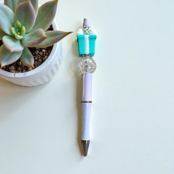 Handcrafted blue present on an iridescent white beaded pen - Picture 2 of 2